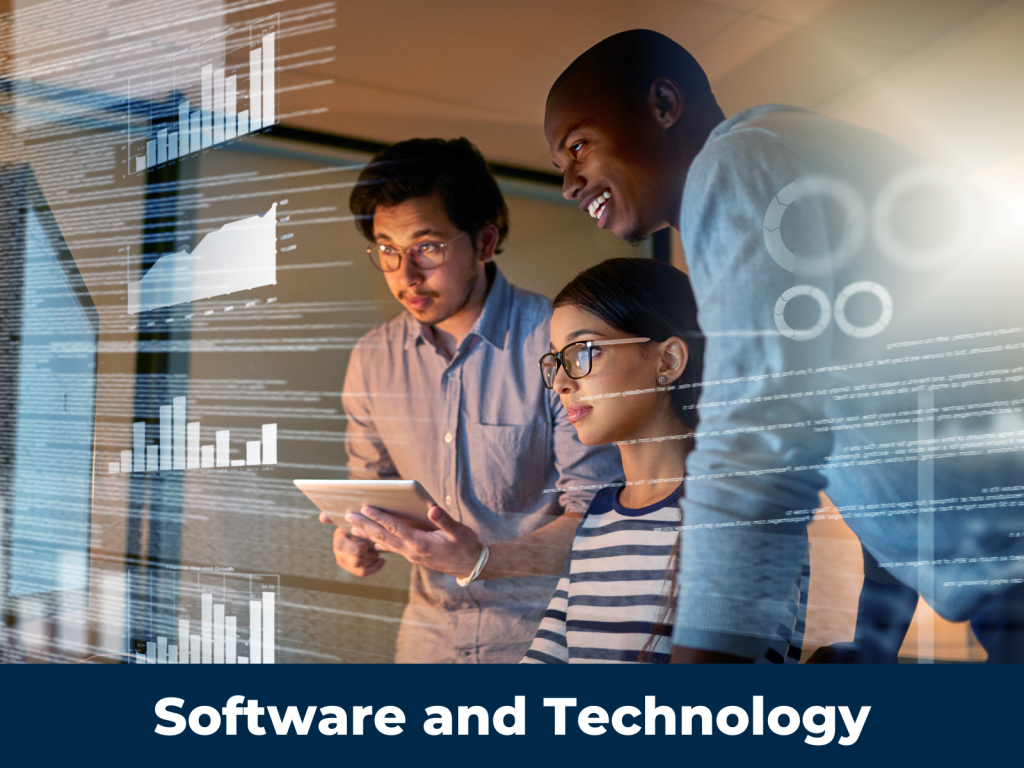 Three programmers analyze graphs on a digital display.