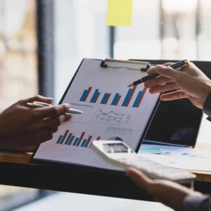 A clipboard showing financial graphs.