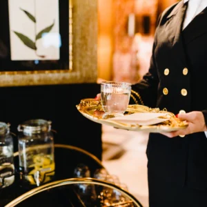 A server serving a beverage.