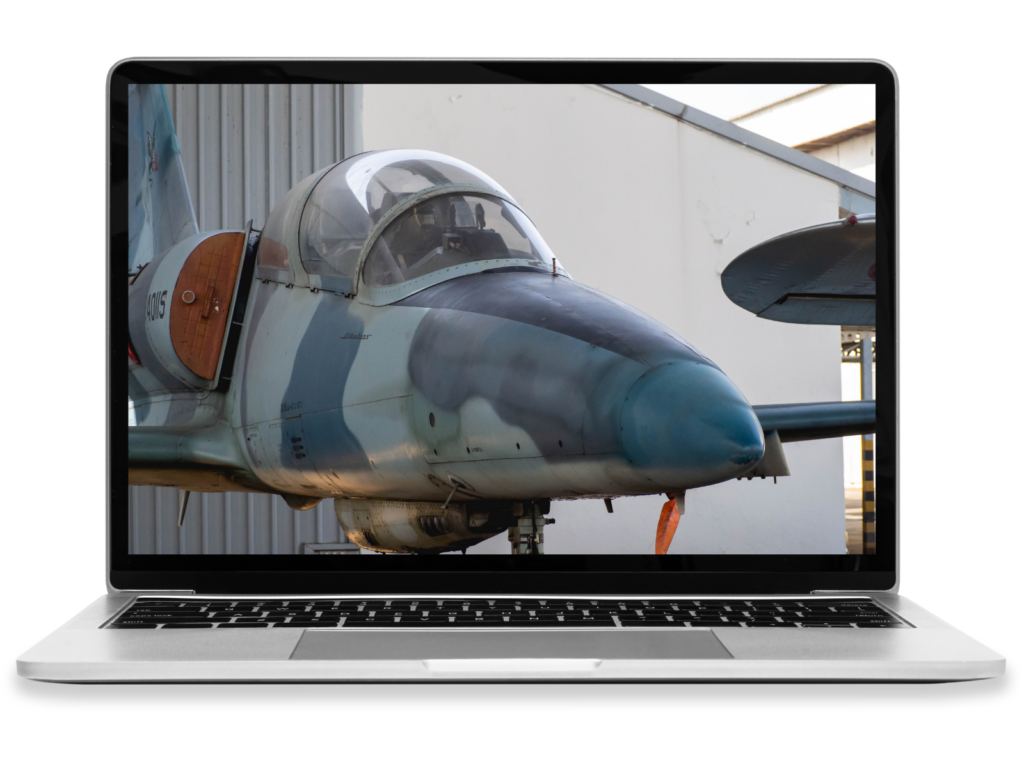 A laptop showing a military jet.
