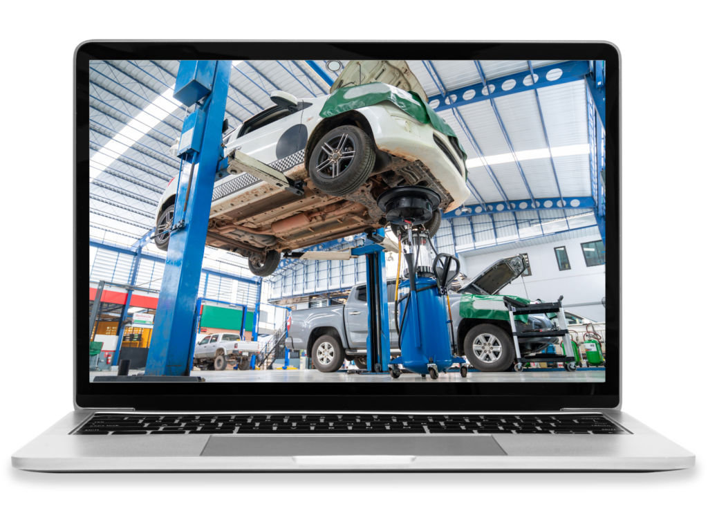 A laptop displaying a car on a lift in an auto repair shop