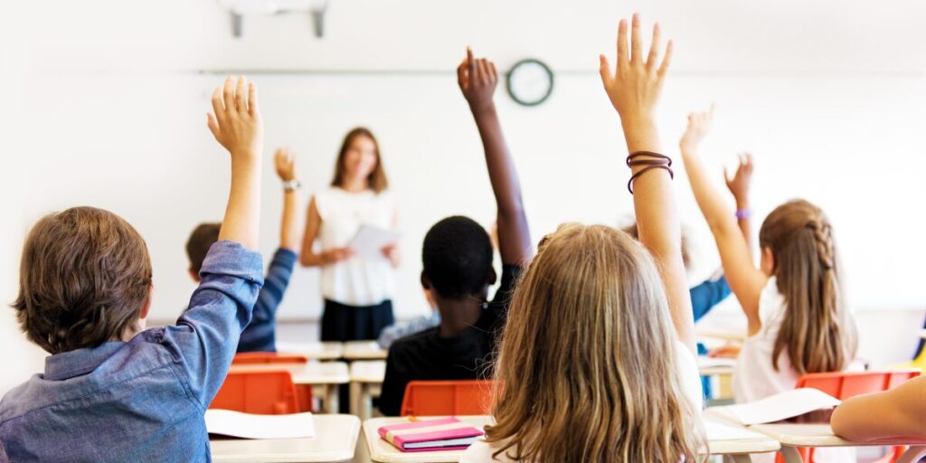A teacher instructs a of children in a classroom.