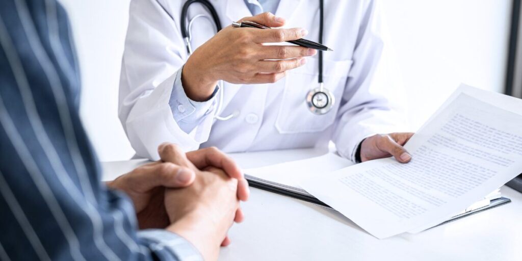 A doctor and patient in a medical facility.