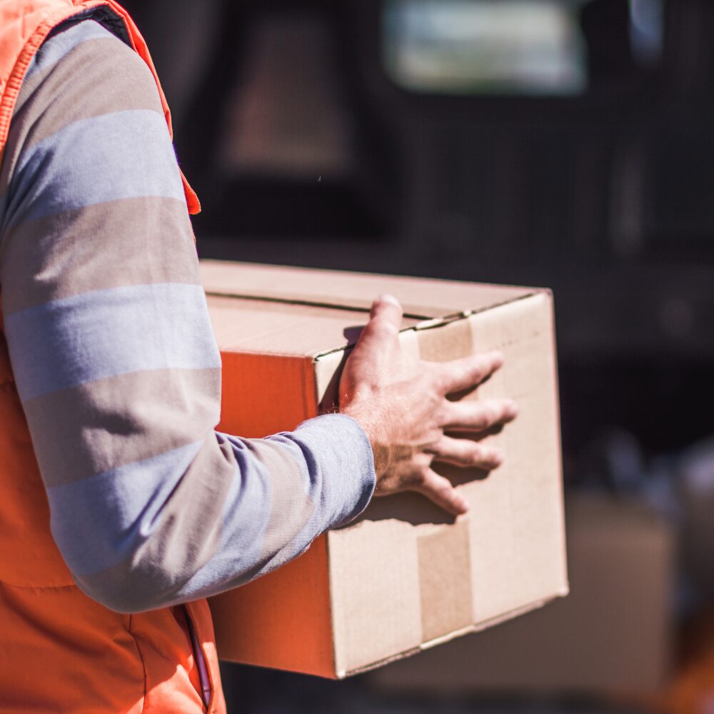 A deliveryperson with a parcel.