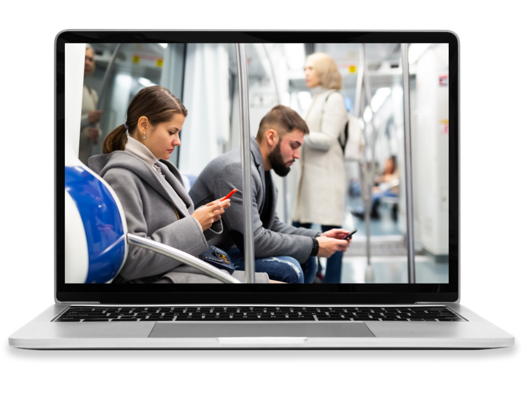 A laptop depicting passengers on a subway.