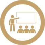 A presenter in front of a whiteboard giving a presentation.